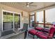 Inviting covered patio featuring outdoor seating and fan at 13502 Brandon Trail Dr, Charlotte, NC 28213