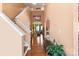 Bright foyer with hardwood floors, a high ceiling, and a staircase leading to the upper level at 13502 Brandon Trail Dr, Charlotte, NC 28213