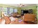 Bright living room featuring plush seating, hardwood floors, and ample space at 13502 Brandon Trail Dr, Charlotte, NC 28213
