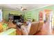 Relaxing living area with comfortable leather seating, hardwood floors, and a ceiling fan at 13502 Brandon Trail Dr, Charlotte, NC 28213
