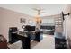 Comfortable office with dark furniture, neutral walls, and a leather sofa, with natural light at 13502 Brandon Trail Dr, Charlotte, NC 28213