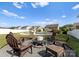 Cozy backyard firepit area with ample seating, perfect for outdoor gatherings and enjoying evenings at 137 Sugar Magnolia Dr, Mooresville, NC 28115