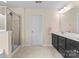Bright bathroom featuring a double vanity, glass shower, and neutral tiling for a clean, modern look at 137 Sugar Magnolia Dr, Mooresville, NC 28115