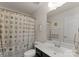 Well-lit bathroom features a decorative shower curtain, vanity and tile flooring at 137 Sugar Magnolia Dr, Mooresville, NC 28115