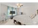 Cozy bedroom with a large window and neutral-toned walls, creating a bright and airy atmosphere at 137 Sugar Magnolia Dr, Mooresville, NC 28115