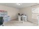 Bright bedroom featuring a large window and a desk that can be used for office or crafting at 137 Sugar Magnolia Dr, Mooresville, NC 28115