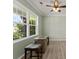 Bonus room featuring a table with stools with a ceiling fan and natural light streaming through the windows at 137 Sugar Magnolia Dr, Mooresville, NC 28115