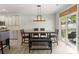 Dining room featuring a modern light fixture and sliding glass door to the yard at 137 Sugar Magnolia Dr, Mooresville, NC 28115