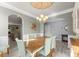 Formal dining room with ample seating and chandelier, perfect for Gathering gatherings and dinner parties at 137 Sugar Magnolia Dr, Mooresville, NC 28115