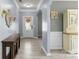 Inviting foyer with hardwood flooring, decorative mirror, and neutral paint, creating a warm welcome at 137 Sugar Magnolia Dr, Mooresville, NC 28115