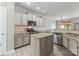 Well equipped kitchen with an island, stainless steel appliances, and tile backsplash, ideal for cooking at 137 Sugar Magnolia Dr, Mooresville, NC 28115