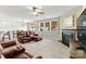 Comfortable living room with a fireplace, ample seating, and natural light at 137 Sugar Magnolia Dr, Mooresville, NC 28115