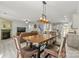 Open-concept living room with fireplace, dining area, and views into the kitchen at 137 Sugar Magnolia Dr, Mooresville, NC 28115