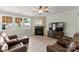 Comfortable living room with a fireplace, ample seating, and natural light at 137 Sugar Magnolia Dr, Mooresville, NC 28115