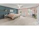Charming bedroom with accent wall, stylish furnishings, and abundant natural light from multiple windows at 137 Sugar Magnolia Dr, Mooresville, NC 28115