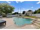 Inviting backyard swimming pool with fountain features, adjacent to a shed and greenery at 137 Sugar Magnolia Dr, Mooresville, NC 28115