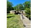 Inviting home featuring covered parking and a wooden walkway at 143 Greenville Blvd, Bessemer City, NC 28016