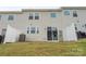 Backyard features include a patio, privacy fence, and green space at 15622 Little Bluestem St, Charlotte, NC 28278