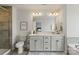 Elegant bathroom with double vanity, frameless glass shower, and modern fixtures, creating a serene and spa-like experience at 15622 Little Bluestem St, Charlotte, NC 28278