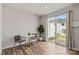 Bright dining area features wood floors and sliding glass doors to the backyard at 15622 Little Bluestem St, Charlotte, NC 28278