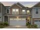 Home exterior shows a two-car garage, stone accents, and manicured bushes at 15622 Little Bluestem St, Charlotte, NC 28278
