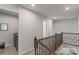 Hallway with laundry room, carpet and wood banister at 15622 Little Bluestem St, Charlotte, NC 28278