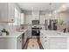 Modern kitchen featuring an island and stainless steel appliances, creating a functional and stylish culinary space at 15622 Little Bluestem St, Charlotte, NC 28278