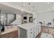 Bright, open kitchen with modern island, pendant lighting, sleek appliances, and seamless flow at 15622 Little Bluestem St, Charlotte, NC 28278