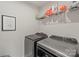 Well-equipped laundry room with modern washer and dryer, offering convenience and efficiency at 15622 Little Bluestem St, Charlotte, NC 28278