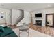 Cozy living room featuring hardwood floors, a fireplace, and stairs leading to the second floor at 15622 Little Bluestem St, Charlotte, NC 28278
