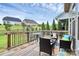 A relaxing wooden back deck with views of the community and beautiful summer sky at 16012 Tulloch Rd, Charlotte, NC 28278