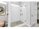 Modern bathroom showcasing a glass shower with subway tile and tiled floors at 16012 Tulloch Rd, Charlotte, NC 28278