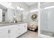 Elegant bathroom featuring a double vanity, granite counters, and a glass-enclosed shower at 16012 Tulloch Rd, Charlotte, NC 28278