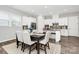 Bright dining area with an open floor plan, stylish decor, and access to the modern kitchen at 16012 Tulloch Rd, Charlotte, NC 28278
