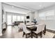 Open-concept dining and living areas with hardwood floors and plenty of natural light at 16012 Tulloch Rd, Charlotte, NC 28278