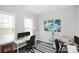 Bright home office with a work space, window, and comfortable chair at 16012 Tulloch Rd, Charlotte, NC 28278