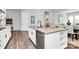 Bright open kitchen features a kitchen island, modern appliances, and ample counter space at 16012 Tulloch Rd, Charlotte, NC 28278