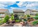 Charming backyard with a screened porch, patio with furniture, and lush landscaping at 16507 Palisades Commons Dr, Charlotte, NC 28278