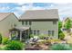 Charming backyard featuring a screened porch, patio with furniture, and landscaped yard at 16507 Palisades Commons Dr, Charlotte, NC 28278