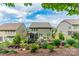 Charming backyard with a screened porch, patio with furniture, and lush landscaping at 16507 Palisades Commons Dr, Charlotte, NC 28278
