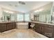 Bright bathroom showcasing dual vanities, corner tub, and stylish tile flooring at 16507 Palisades Commons Dr, Charlotte, NC 28278