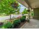 Charming front porch view featuring lush landscaping and a well-maintained street at 16507 Palisades Commons Dr, Charlotte, NC 28278