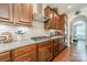 Kitchen featuring granite countertops, a gas cooktop, stainless steel appliances, and hardwood floors, offering a modern cooking space at 16507 Palisades Commons Dr, Charlotte, NC 28278