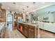 Well-designed kitchen with a granite island, pendant lights, and seamless connection to the living and dining areas at 16507 Palisades Commons Dr, Charlotte, NC 28278