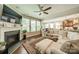 Open concept living room with a fireplace and seamless flow to the kitchen and dining area at 16507 Palisades Commons Dr, Charlotte, NC 28278