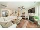 Spacious living room featuring a fireplace, large sectional sofa, and staircase at 16507 Palisades Commons Dr, Charlotte, NC 28278