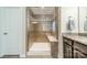 Modern glass enclosed shower featuring tile surround, bench, and upgraded shower head at 16507 Palisades Commons Dr, Charlotte, NC 28278