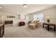 Spacious carpeted room with half wall, large windows, reading nook, and stylish decor at 199 Blossom Ridge Dr, Mooresville, NC 28117