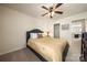 Comfortable bedroom offering a queen-sized bed, fan, and ample closet space at 199 Blossom Ridge Dr, Mooresville, NC 28117