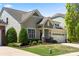 Well-maintained home with lush landscaping and a convenient two-car garage in a friendly community at 199 Blossom Ridge Dr, Mooresville, NC 28117